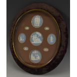 An arrangement of nine 19th century Wedgwood Jasperware plaques,
