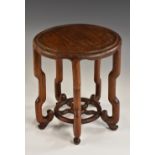 A Chinese hardwood circular table top vase stand, shaped legs, pierced undertier, 22.5cm high, c.