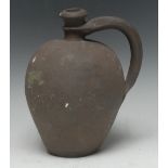 Antiquities - a post-Medieval earthenware ovoid ale jug, loop handle, 23cm high,