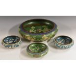 A Chinese cloisonne enamel bowl, decorated with flowers and scrolls on a green ground, 31cm diam,