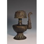 A Chinese dark patinated bronze water dropper, in the Archaic taste, cast with scrolls and lotus,