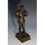 Japanese School (Meiji/Taisho Period), a dark patinated bronze, of a violinist, he stands,