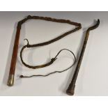 A late 19th century Colonial hardwood and leather whip, silvered pommel inscribed H E Dumbell,