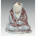 A Japanese porcelain figure, of Daruma in meditation, his repose disturbed by a fly,