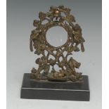 A 19th century bronze pocket watch stand, cast with birds and a rabbit amongst trailing branches,