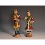 A pair of Indian beadwork figures, of a musician and a dancer, 16.