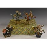 A pair of Chinese hardstone model trees, each with blossoming branches,