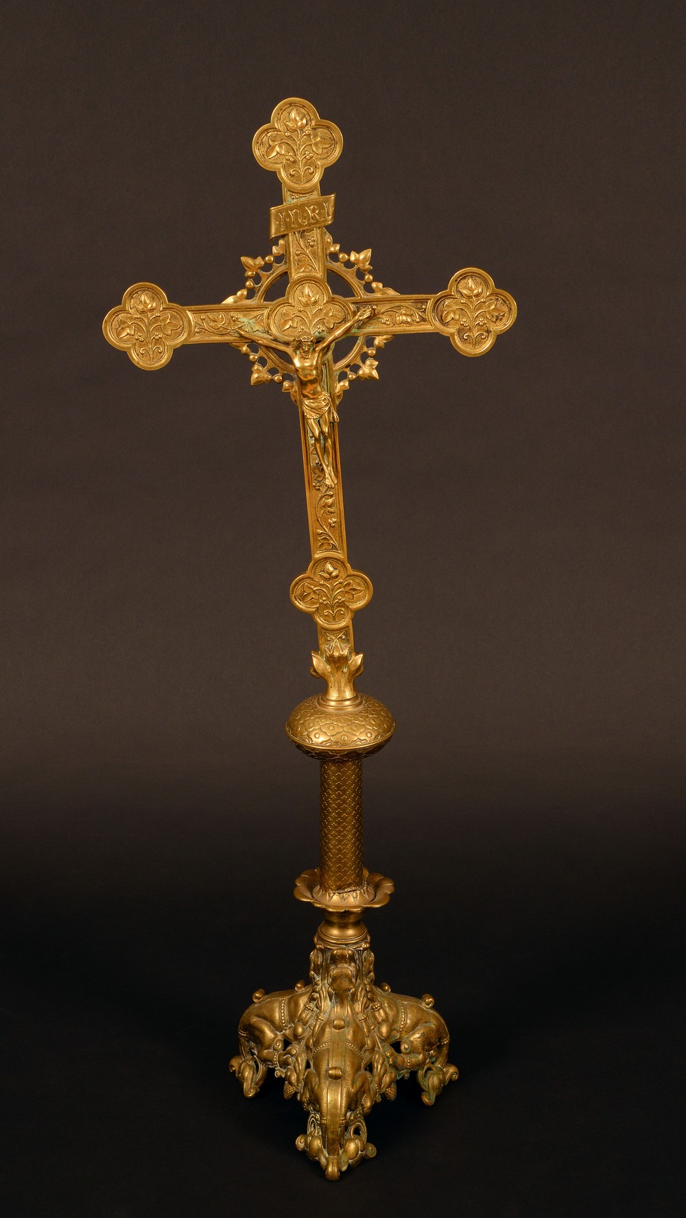 A Medieval Revival gilt brass alter Corpus Christi, of Christ crucified on a cross bottony,