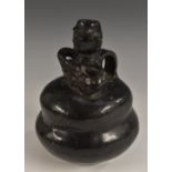 A South American black ware figural vessel, in the typical South Columbian manner,