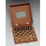 An early 20th century mahogany travelling chess set, The Ditty Chess Box, by John Jaques & Son,