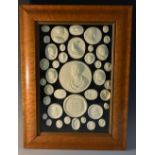 An arrangement of plaster cameo impressions, various Grand Tour, Medieval and 19th century subjects,