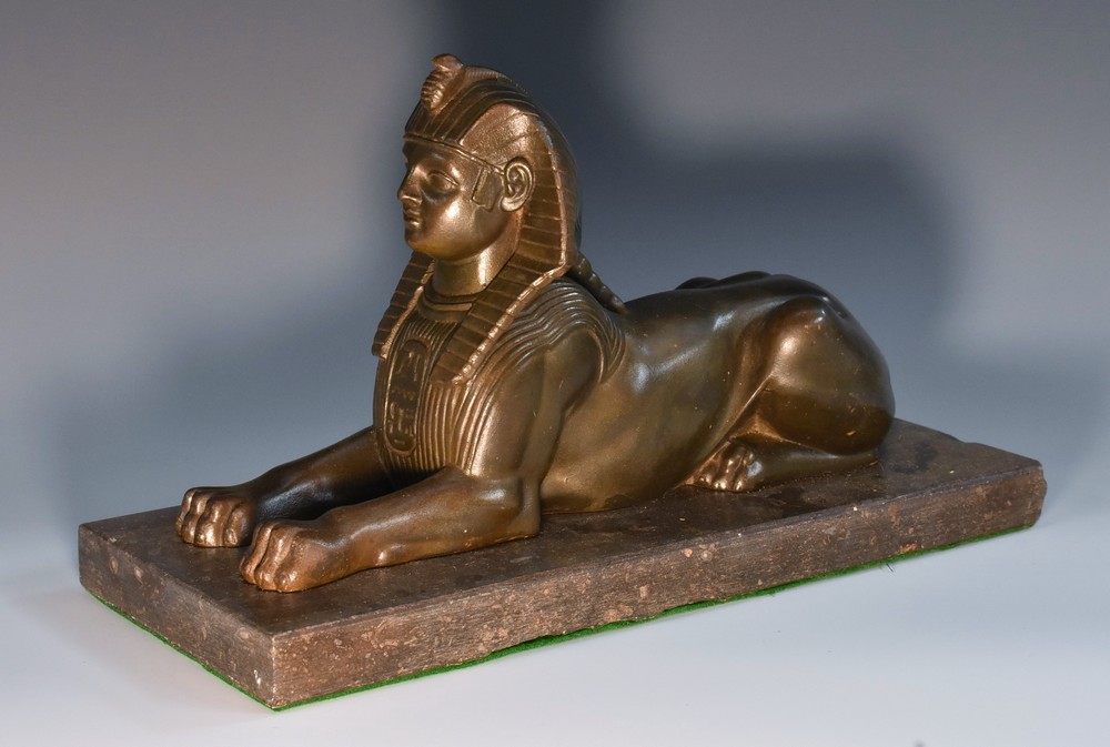 A Grand Tour stone model, of a sphinx, rectangular marble base,