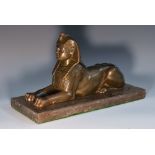 A Grand Tour stone model, of a sphinx, rectangular marble base,