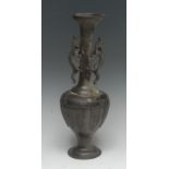 A Chinese bronze slender ovoid vase, the tall flared neck applied with a pair of dragons,
