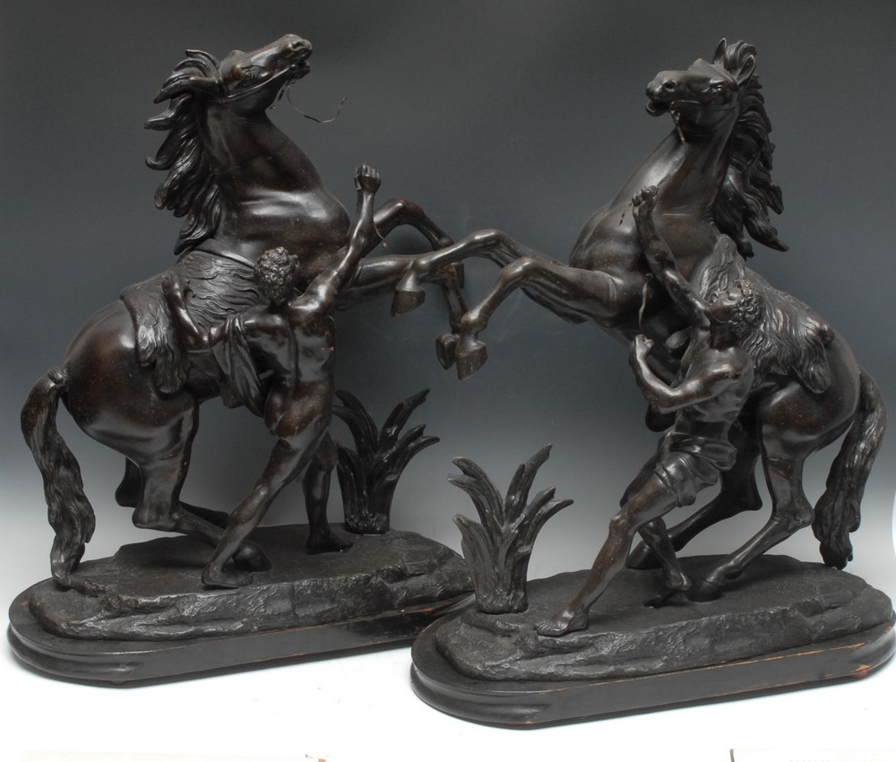 French School (19th century), a pair of large brown patinated spelter equestrian library sculptures,