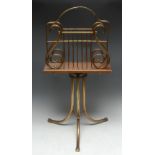 An Edwardian gilt brass-mounted mahogany periodical or music stand, turning lyre-shaped canterbury,