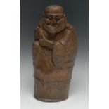 A Chinese bamboo figure, carved as Liu Hai, the toad pulling at his ear, 31.