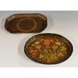 A 19th century Kashmiri papier mache and penwork oval tray, decorated in polychrome with flowers,
