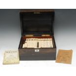 A Chinese bone and bamboo mahjong set, the tiles 3cm wide,
