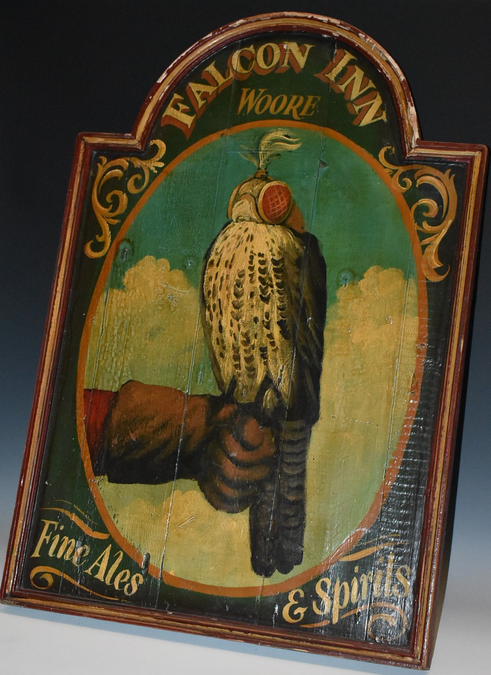 Folk Art - a painted softwood arched rectangular hanging tavern sign, Falcon Inn, Woore,