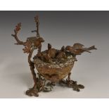 A 19th century bronze novelty inkwell, cast as nest of birds,