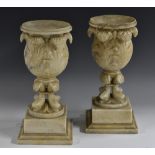 A pair of 19th century alabaster bell shaped mantel vases, boldly carved with scrolling acanthus,