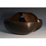 A coco de mer (Lodoicea maldivica), cut and polished as a hand basket,