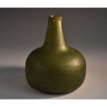 An 18th century green glass onion bottle, opaque interior, 15cm high, collection no.