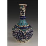 An Iznik design guglet, painted in tones of blue,