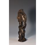 Tribal Art - a Senufo figure, he stands, with ridged coiffure, 18.
