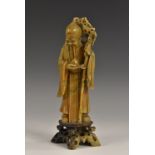 A Chinese two-tone soapstone figural carving, of Shou-Lao,