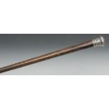 A late 19th century silver coloured metal mounted gentleman's walking cane,