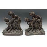 French School, a pair of dark-patinated bronzes, of Bacchic putti fawning over sacrificial goats,