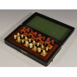 An early 20th century travelling chess set, turned pieces, folding board, 16.