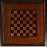 A 19th century oak and parquetry country house chess board, the field inlaid for games,