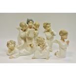 Lladro figures- an angel/putti group,