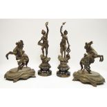 A pair spelter mantel garnitures as rearing horses on decorative plinth base c.