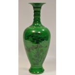 A Chinese vase, decorated with a monumental landscape and script, on a green ground,