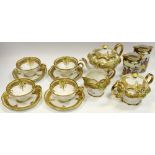 A Noritake lobed tea service with raised gilt foliage & band picked out in colours comprising