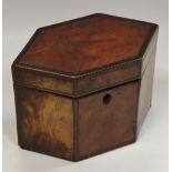 A Regency walnut tea caddy of elongated hexagonal form with barber pole stringing throughout,
