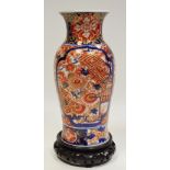 A Japanese baluster vase, painted in the Imari palette, eight character mark, Meiji period,