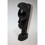 Tribal Art - a carved hardwood African bust, 23.