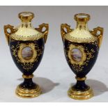 A pair of Coalport miniature two handled pedestal vases,