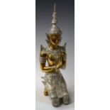 A coloured metal figure, as an Indian deity kneeling,