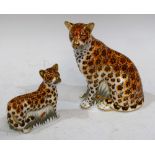 A Royal Crown Derby paperweight, Leopardess, gold stopper, boxed; another, Leopard Cub,