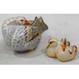 A Royal Crown Derby paperweight group, Goose "Mrs Brown" and Goslings, gold stoppers,