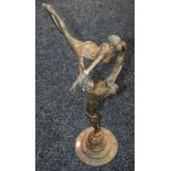 A bronzed metal figure group, Holding Aloft,