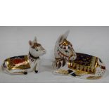 A Royal Crown Derby paperweight, Thistle Donkey, gold stopper; another, Holly Donkey Foal,