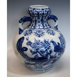 A Chinese Export ware blue and white two handled vase, decorated with fanciful birds,