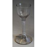 An English cordial glass, bucket shaped bowl, cotton twist stem, spreading circular base, 14cm high,